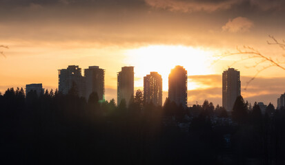 Fototapeta na wymiar Residential apartments highrises in Metrotown Area. Taken in Deer Lake, Burnaby, Vancouver, BC, Canada. Sunset