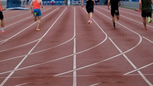 back athletes runners run sprint race at stadium
