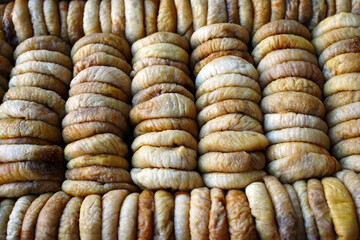 dried figs laid out in a supermarket window. background, food texture. concept of healthy eating.