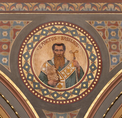 BERN, SWITZERLAND - JUNY 27, 2022: The fresco of St. Basil the Great in the church Dreifaltigkeitskirche by August Müller (1923).