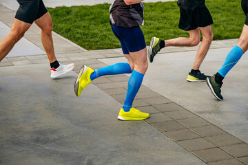 Fototapeta premium group legs runners men run race