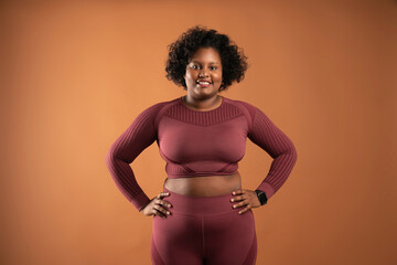 body positive curvy black girl wearing sportswear in studio feminist woman
