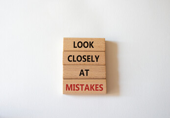 Look closely at mistakes symbol. Wooden blocks with words Look closely at mistakes. Beautiful white background. Business and Look closely at mistakes concept. Copy space.