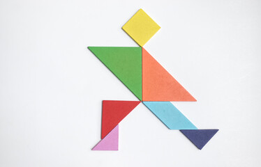 color tangram puzzle in aerobic exercise man shape on white background