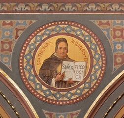 BERN, SWITZERLAND - JUNY 27, 2022: The fresco of St. Thomas Aquinas in the church Dreifaltigkeitskirche by August Müller (1923).