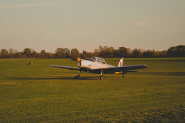 Fototapeta na wymiar Airplane at the field