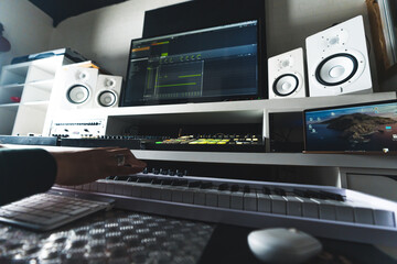 Music production desk with equipment at home studio. High quality photo