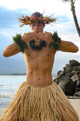 Male Hula Dancer in a kiss gesture with his hands. 