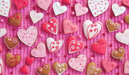 Cookies in the shape of hearts on a knitted background. Valentine's Day Concept