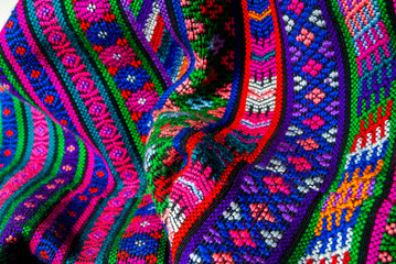 Handmade textile detail made by Guatemalan artisan in Central America, colorful detail full of tradition and culture, colonial history, Mayan cosmovision. 