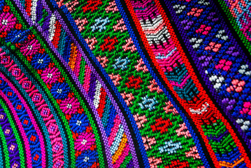 Handmade textile detail made by Guatemalan artisan in Central America, colorful detail full of tradition and culture, colonial history, Mayan cosmovision.  - 566727241
