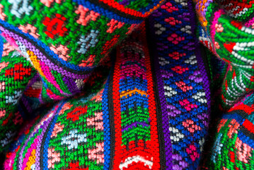 Handmade textile detail made by Guatemalan artisan in Central America, colorful detail full of tradition and culture, colonial history, Mayan cosmovision. 