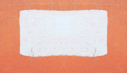 Photo of a concrete painted wall. In the center is a rectangular painted area. Natural background, backdrop.