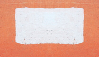 Photo of a concrete painted wall. In the center is a rectangular painted area. Natural background, backdrop.