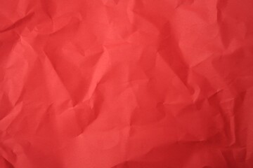Fototapeta premium Sheet of crumpled red paper as background, top view