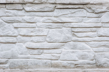 Background, texture of a wall made of gray concrete, stone bricks. Photography, abstraction.