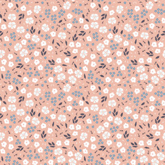 ditsy pattern with small flowers on pink