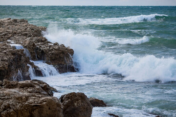 Beautiful seascape. The Black Sea coast. The waves are beating against the rocks. Russia, Crimea.