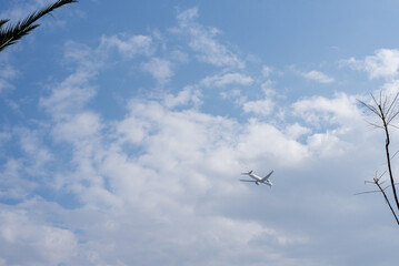 airplane in the cloudy sky, background
