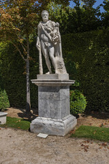 Antique sculpture in Gardens of Versailles palace. Versailles, France.