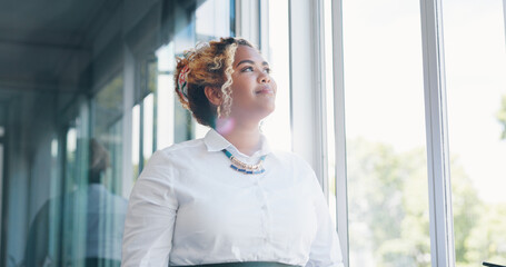 Face, vision and mindset with a business black woman in her office, standing by a window with...