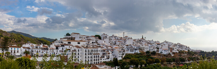 Panoramic photograph of Frigiliana, Málaga, one of the most beautiful towns in Spain. With its white  walls, its narrow streets and a lot of stairs.