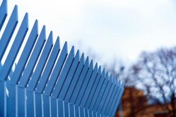 Top of security fence with pointed and curved pommels