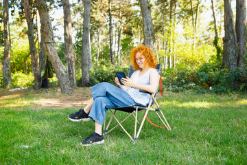 Young woman resting in nature and reading