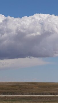 Vertical Video Massive Cumulus Clouds in Open Landscape