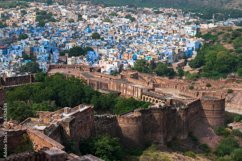 Wall mural top view of mehrangarh fort with distant view of blue city jodhpur, rajasthan, india. blue sky with 