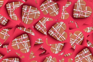 Fototapeta na wymiar Pattern from Heart-shaped cookies on magenta background. Trendy Color of Year 2023. Festive background concept for Valentine's Day. Close-up