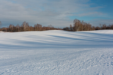 sunny, snowy winter day in the countryside