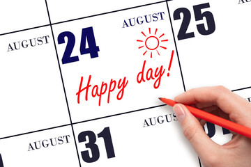 Hand writing the text HAPPY DAY and drawing the sun on the calendar date August 24
