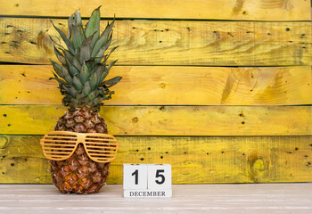 Creative planner calendar december with number  15. Pineapple character on bright yellow summer...