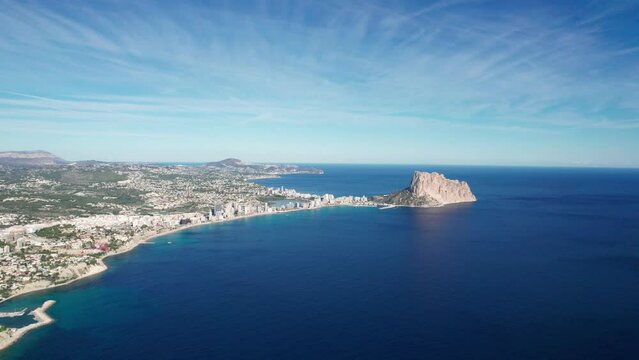 A seaside city on the shores of the Mediterranean Sea. Spanish town of Calp in top view.