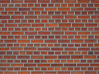 Old brick wall with new grouting. Restored red brick wall.