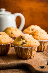 Sweet vanilla muffins  on cutting board.
