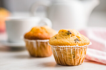 Sweet vanilla muffins on kitchen table.