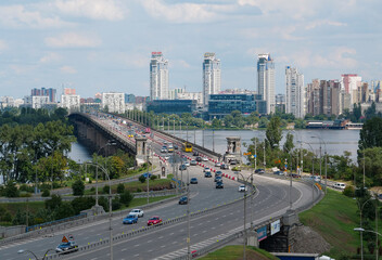 Fototapeta na wymiar View of Paton Bridge and left bank of Dnieper river in Kyiv city, Ukraine
