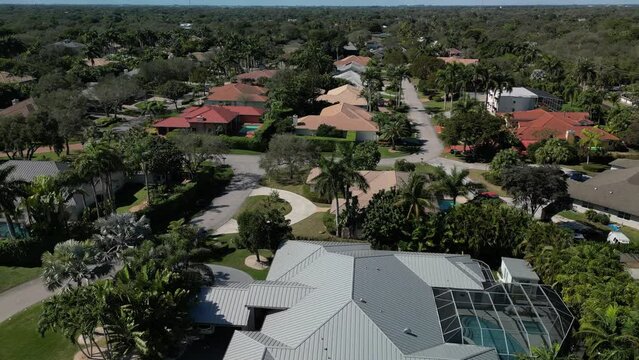 Aerial view looking down from above at luxury real estate in an upscale neighborhood
