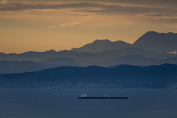 Fototapeta na wymiar Koper gulf with mountains in background