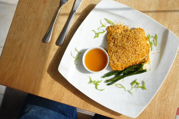 Fish fillet , chips and potato mash on table 