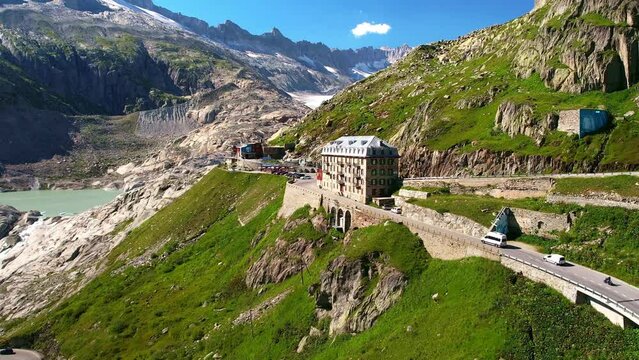 Drone Switzerland 4k. mountain pass winding roads in Swiss Alps. Switzerland summer Furka Pass road trip, tourism destination.