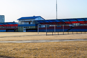 city small football stadium. organization of public space. Public amphitheater, empty seats in Smorgon, Belarus
