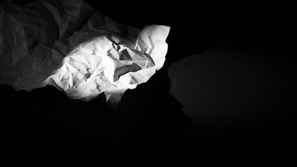 Crumbled white piece of paper