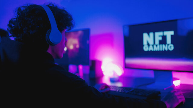 Young gamers buying NFT with token on marketplace platform for metaverse video game - Crypto technology trends - Focus on headphone