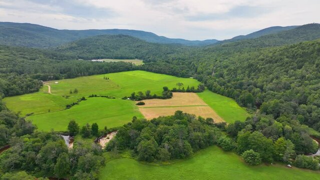 Flying over Beebe River in the Campton Mountain near Bumps Covered Bridge with White Mountain National Forest at the background in town of Campton, New Hampshire NH, USA. 