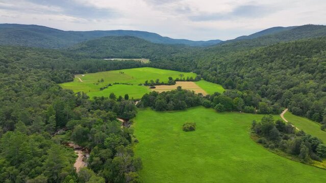 Flying over Beebe River in the Campton Mountain near Bumps Covered Bridge with White Mountain National Forest at the background in town of Campton, New Hampshire NH, USA. 