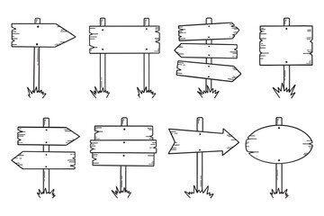 Wooden road signs doodle set. Wooden direction signs and arrows in sketch style.  Hand drawn vector illustration isolated on white background. © AnyaLi