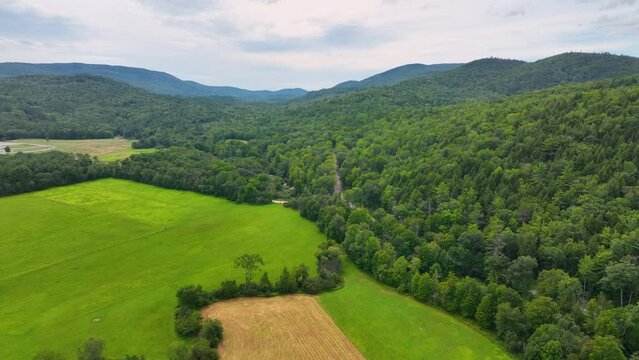 Flying over Beebe River in the Campton Mountain near Bumps Covered Bridge with White Mountain National Forest at the background in town of Campton, New Hampshire NH, USA. 